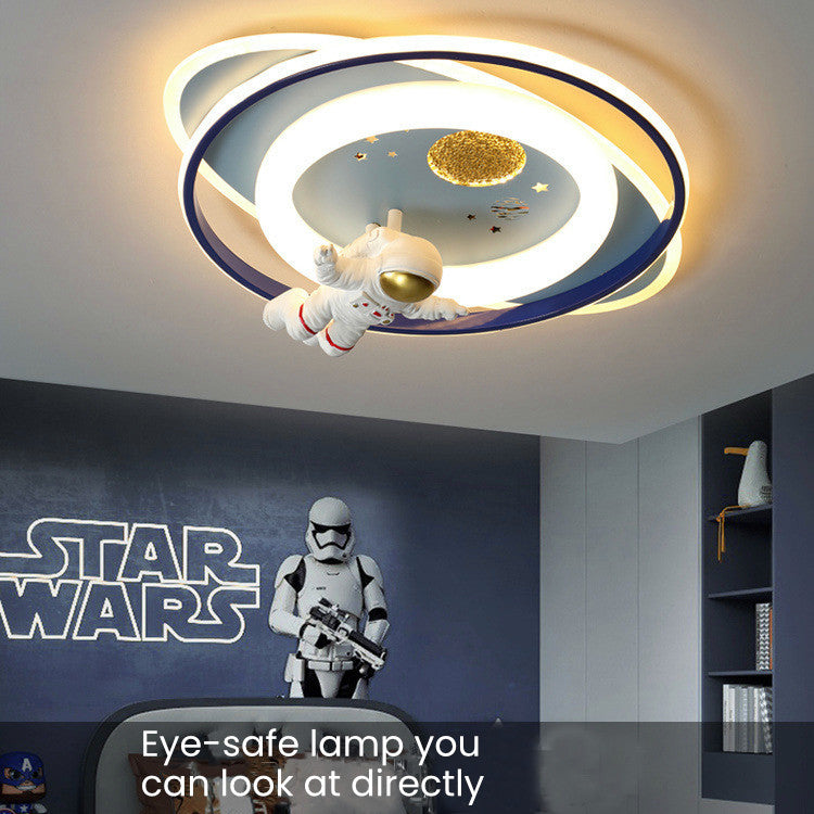 Close-up of astronaut ceiling light design on kids LED lamp showing details and soft diffused glow, eye-protective cover