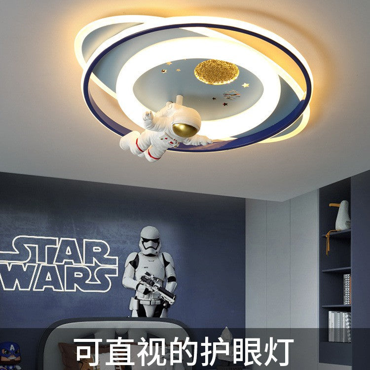 Close-up of astronaut ceiling light design on kids LED lamp showing details and soft diffused glow, eye-protective cover