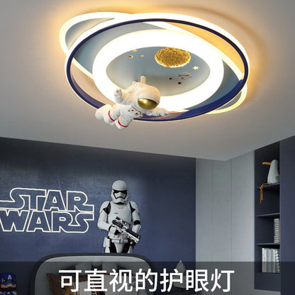 Close-up of astronaut ceiling light design on kids LED lamp showing details and soft diffused glow, eye-protective cover