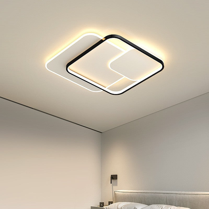 Detail of ceiling light metal frame and mounting hardware in brushed finish